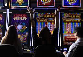Multi-camera view of waktogel online live studio showing dealer stations, card tables, and roulette wheel with HD camera equipment mounted overhead